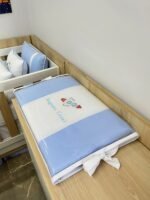 Trocador de cômoda tema astronauta.